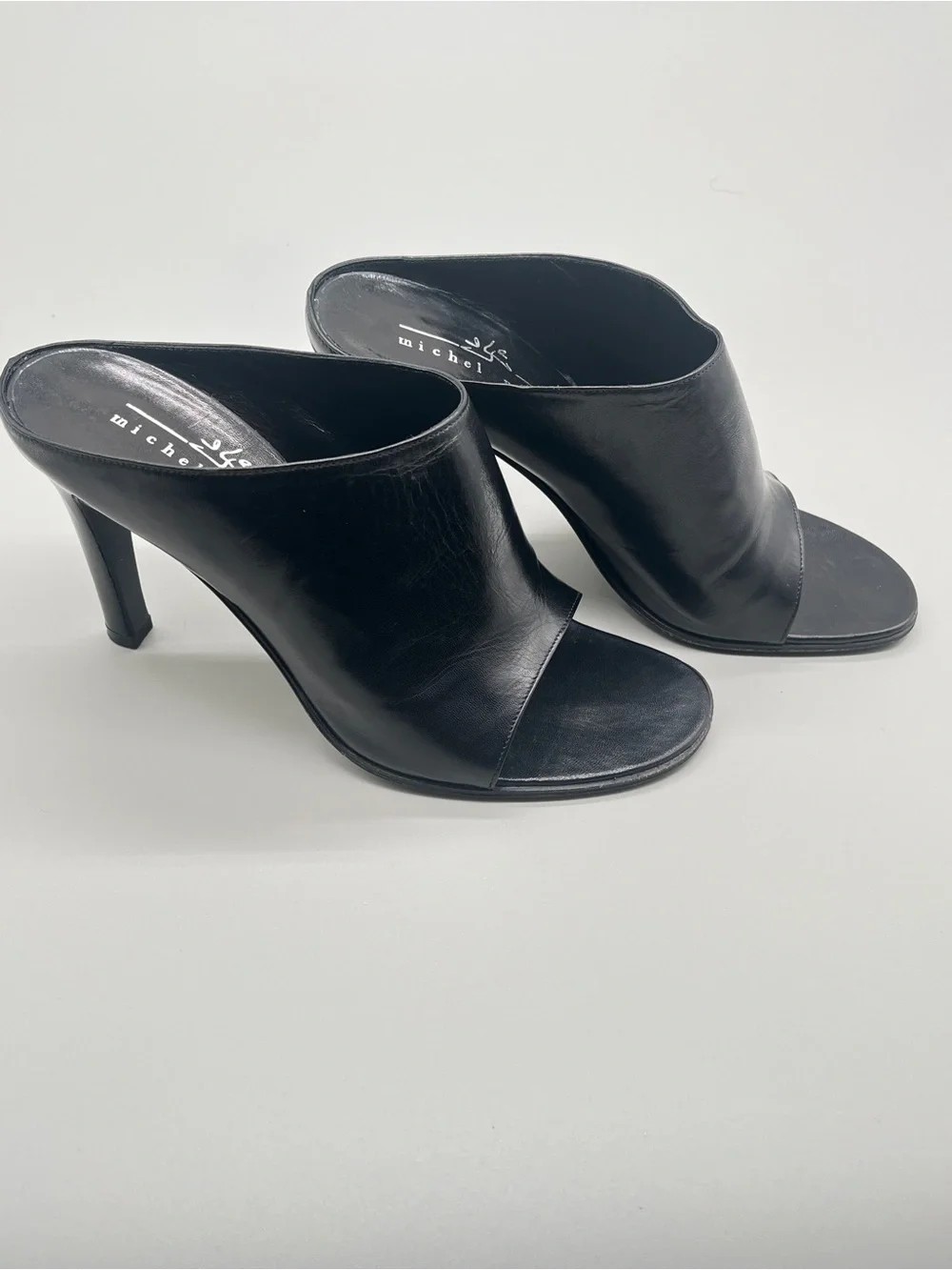 Michel Perry black heeled mules. wide leather strap. Made in Italy. Size 37.